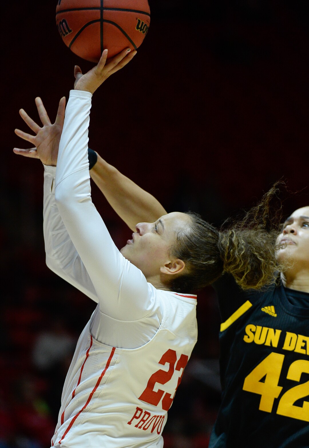 (Francisco Kjolseth  |  The Salt Lake Tribune)  Utah Utes guard/forward Daneesha Provo (23) sails one in past Arizona State Sun Devils forward Kianna Ibis (42) in Utes' Pac-12 home opener at the Jon M Huntsman Center on Friday, Jan. 4, 2019. They're off to one of their best starts in team history.