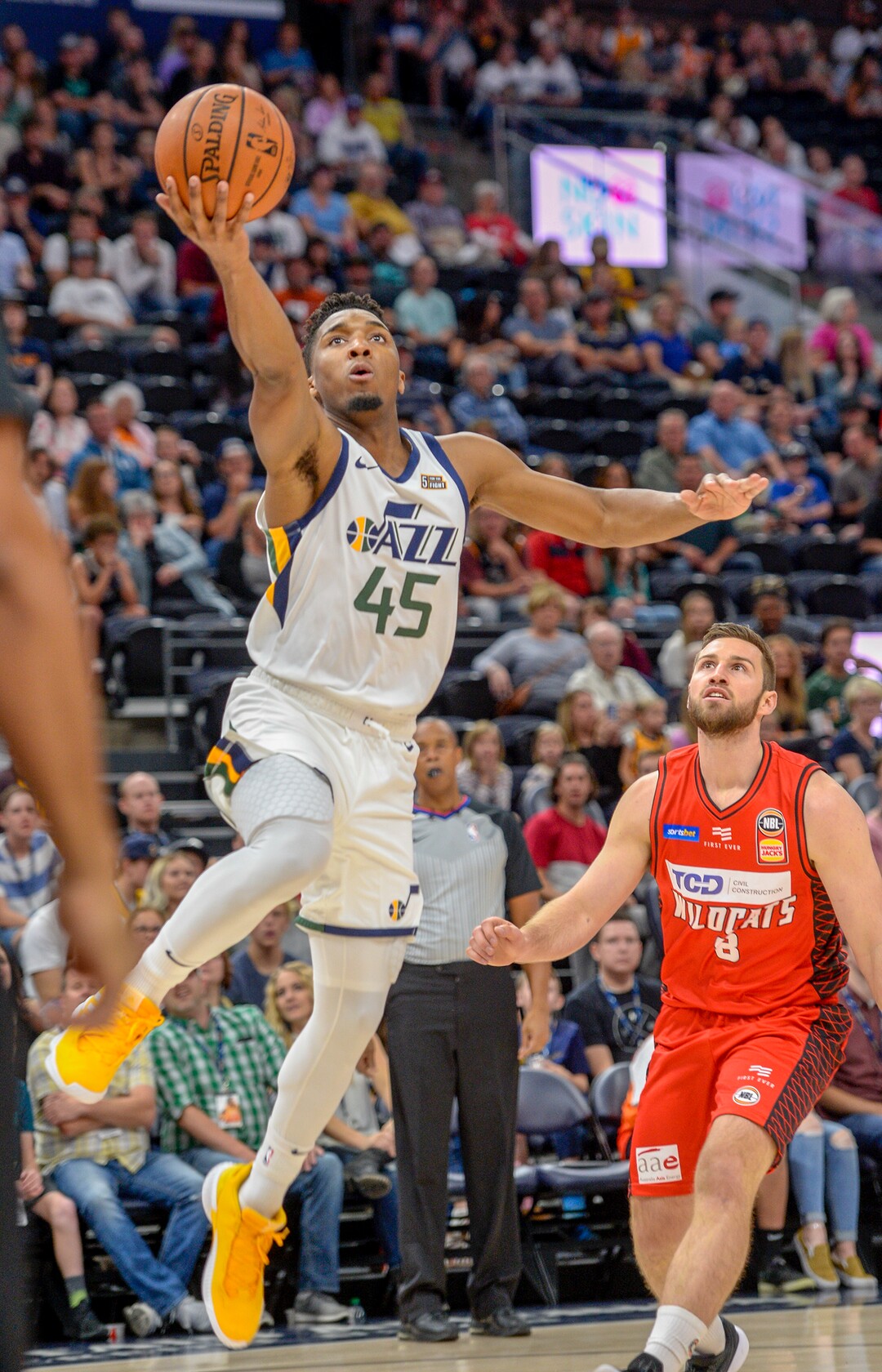 Leah Hogsten  |  The Salt Lake Tribune   Utah Jazz guard Donovan Mitchell (45) skies to the net as the Utah Jazz host the Perth Wildcats, Sept. 29, 2018 at Vivint Smart Home Arena.