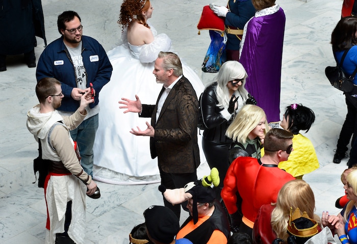(Scott Sommerdorf | The Salt Lake Tribune) FanX Salt Lake Comic Convention co-founder Dan Farr, center, gives an interview to a fan in the Utah Capitol Rotunda, Wednesday, April 11, 2018.