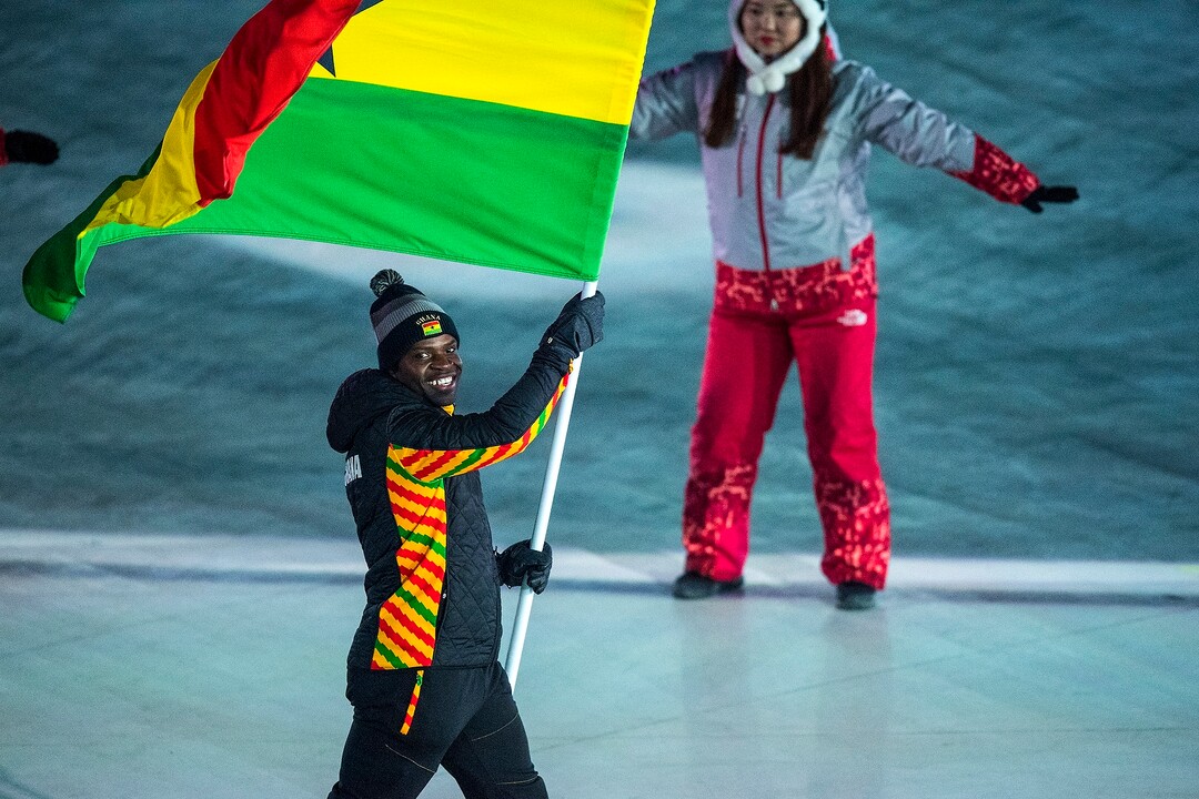 (Chris Detrick  |  The Salt Lake Tribune)  Former Utah Valley University sprinter Akwasi Frimpong carries the flag of Ghana during the Pyeongchang 2018 Winter Olympics opening ceremony at Olympic Stadium Friday, February 9, 2018.  