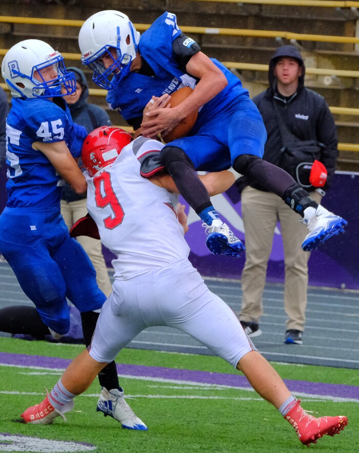 (Leah Hogsten  |  The Salt Lake Tribune) Beaver's quarterback Porter Hollingshead pulls down the interception over Delta's Robert Clark. Beaver High School boys' football team defeated Delta High School 35-16 during their class 2A state semifinal football game Saturday, November 4, 2017 at Weber State University's Stewart Stadium.