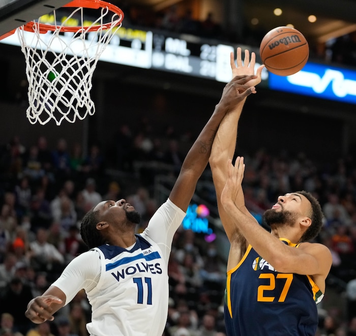 (Francisco Kjolseth | The Salt Lake Tribune) Minnesota Timberwolves center Naz Reid (11) battles Utah Jazz center Rudy Gobert (27) for a rebound in NBA action between the Utah Jazz and the Minnesota Timberwolves at Vivint Smart Home Arena in Salt Lake City, Thursday, Dec. 23, 2021.