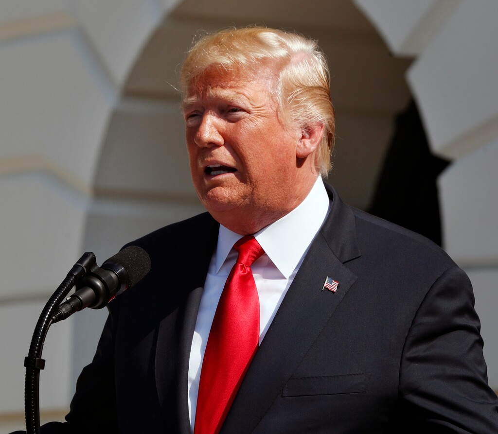 FILE - In this July 27, 2018, file photo, President Donald Trump delivers remarks on the economy from the South Lawn of the White House, in Washington. Trump met with the publisher of The New York Times to discuss media coverage of his administration, including the president’s oft-repeated accusation that the media is the “enemy of the people,” Trump and the newspaper said Sunday, July 29, 2018. The meeting with A.G. Sulzberger occurred July 20, the White House and Times said. (AP Photo/Jacquelyn Martin, File)