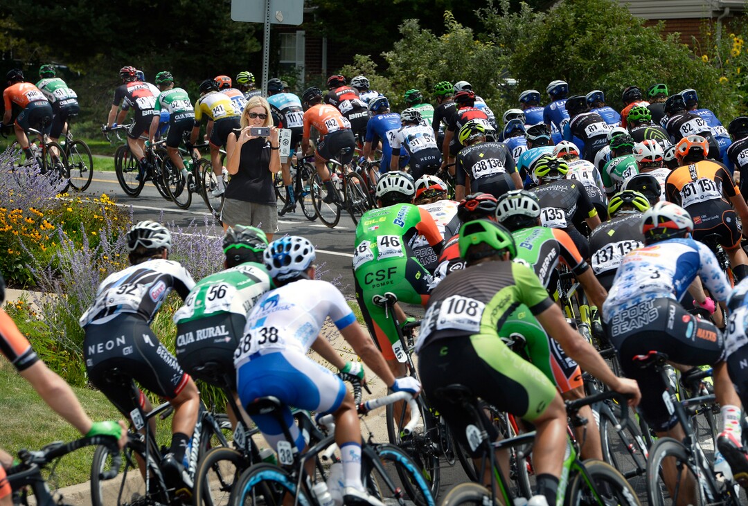 (Scott Sommerdorf   |  The Salt Lake Tribune)   An avenues resident makes photos as riders make the turn from Bonneville Blvd. onto 11th Ave. just after the start of stage 7 of the Tour of Utah. Robert Britton is the winner of the 2017 Tour of Utah, Sunday, August 6, 2017.  