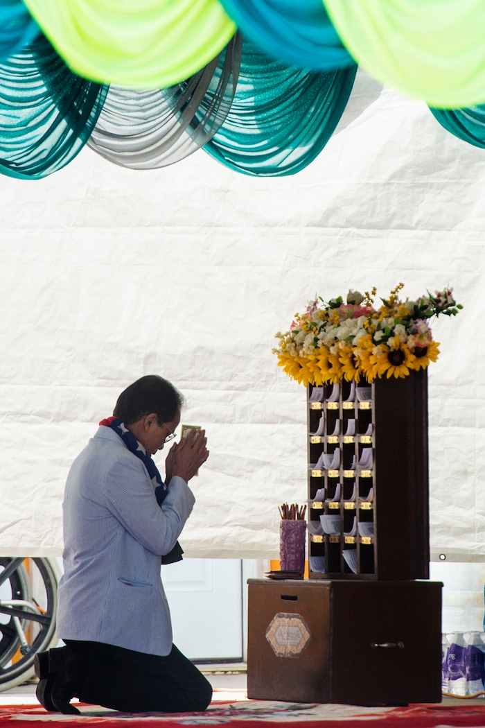 (Rick Egan  |  The Salt Lake Tribune)    A man worships at the Wat Lao Salt Lake Buddharam Utah, New Year Celebration, in West Valley City, Sunday, April 28, 2019.


