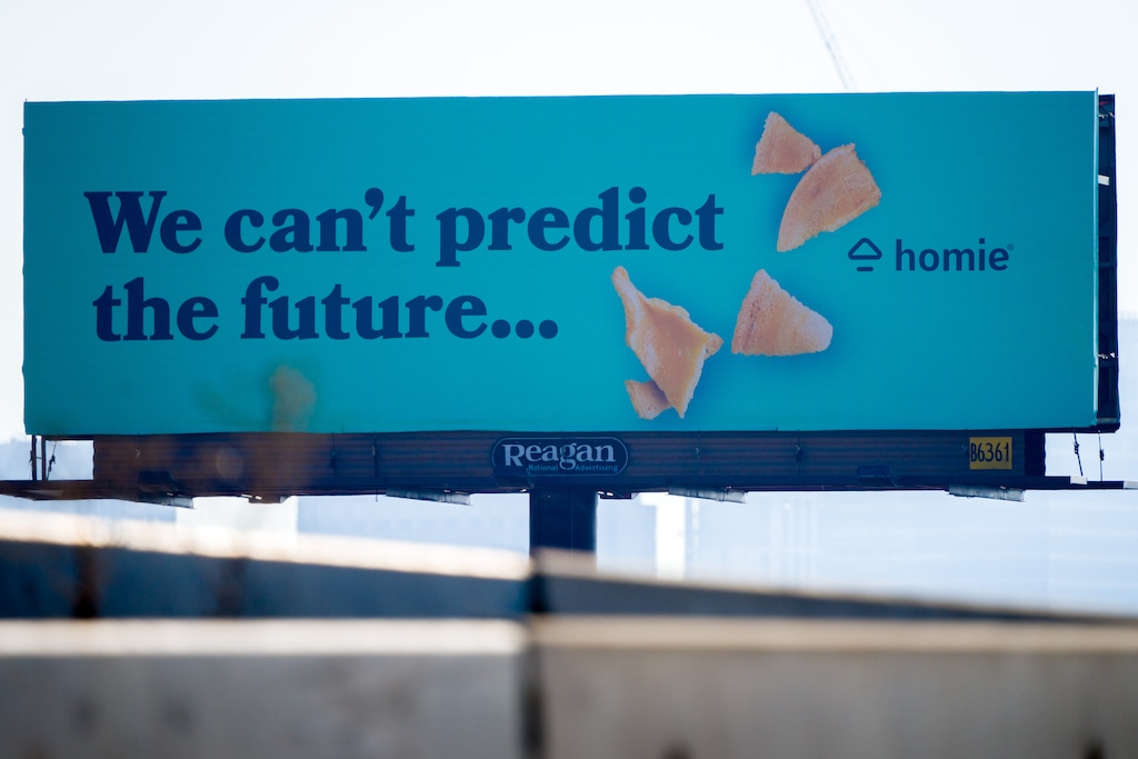 (Trent Nelson  |  The Salt Lake Tribune) A billboard for the real estate company Homie, along Interstate 15 in Salt Lake City on Wednesday November 22, 2023.