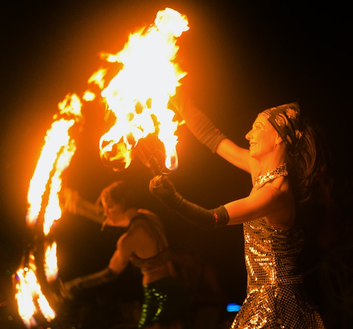(Rick Egan  |  The Salt Lake Tribune)  Krista Lockwood and Lindy Zuroski, dance with fire, with the Lady Fire Circus from Ft. Collins, Co, during Burning Man.  Thursday, August 31, 2017.
