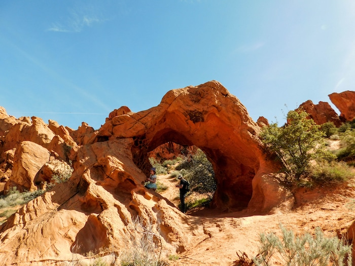 The Salt Lake Tribune|Erin Alberty
Hikers play at Babylon Arch on March 12, 2017 in the Red Cliffs Desert Reserve near Leeds.