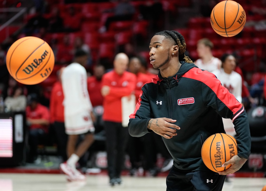 (Francisco Kjolseth  |  The Salt Lake Tribune) Utah Utes guard Deivon Smith (5) helps the team warm up at the Huntsman Center in Salt Lake City on Wednesday, Nov. 01, 2023.