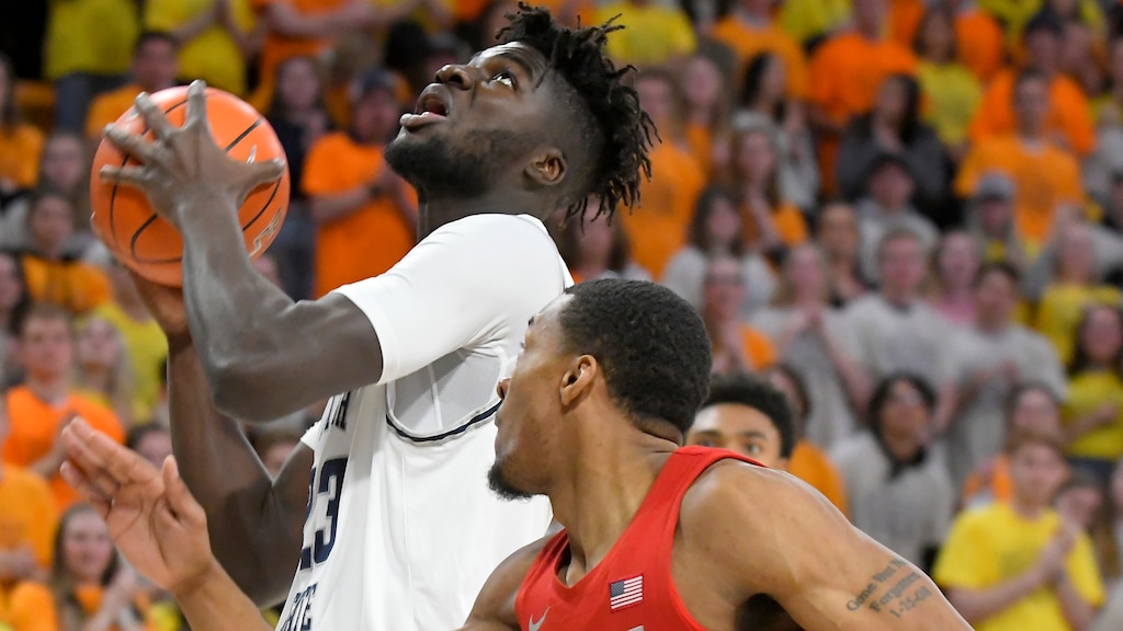 Utah State center Neemias Queta (23) looks to shoot as UNLV forward Nick Blair (20) defends during the first half of an NCAA college basketball game Wednesday, Feb. 5, 2020, in Logan, Utah. (Eli Lucero/The Herald Journal via AP)