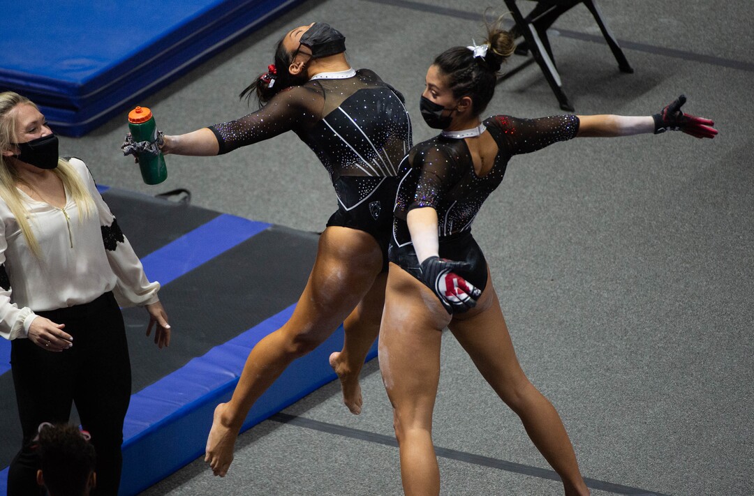 (Francisco Kjolseth  | The Salt Lake Tribune) Cristal Isa and Emilie Leblanc celebrate in PAC-12 gymnastics action Utah vs UCLA, at the Huntsman Center on Friday, Feb. 19, 2021.