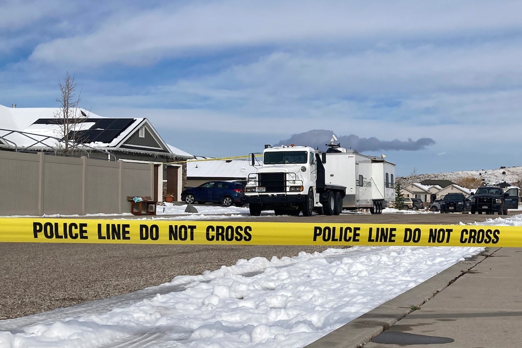 FILE - A police line outside a home where eight family members were found dead in Enoch, Utah, on Jan. 5, 2023. (AP Photo/Sam Metz, File)