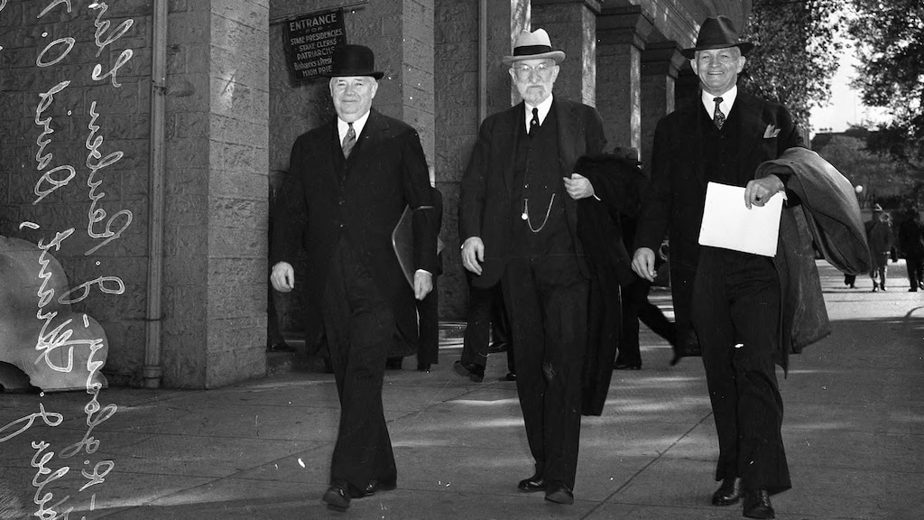 (photo courtesy Utah State Historical Society/Tribune negative collection) President Heber J. Grant, of The Church of Jesus Christ of Latter-day Saints, center, walks past the Tabernacle at Temple Square with the other members of the First Presidency, J. Reuben Clark, left, and David O. McKay, right.