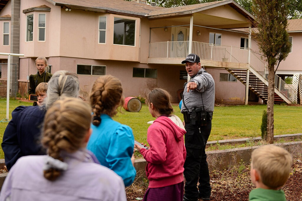 (Trent Nelson  |  The Salt Lake Tribune) Colorado City Town Marshal Sam Johnson orders young FLDS children to leave the property of a home being taken over by the UEP Trust in Colorado City, Ariz., Wednesday May 10, 2017.