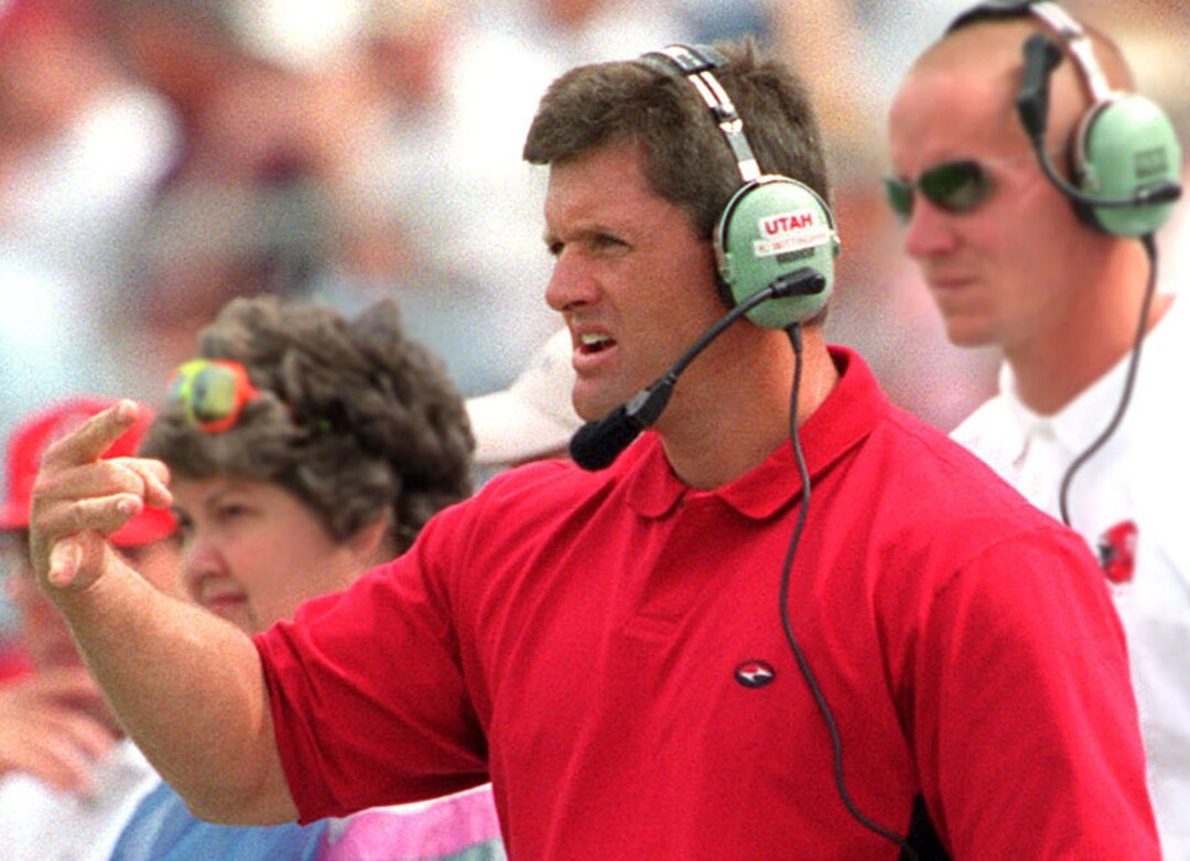 Rick Egan  |  The Salt Lake Tribune Kyle Whittingham talks to the defensive  on the sidelines of the Utah football game against Washington State on September 4, 1999. 