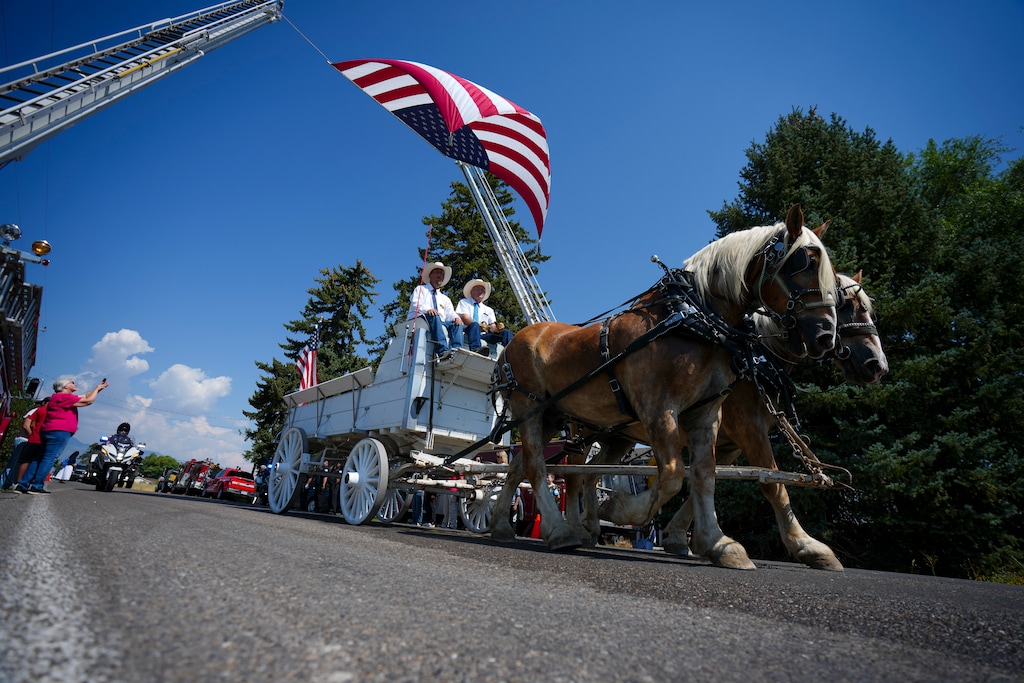 (Bethany Baker | The Salt Lake Tribune) A horse-drawn carriage carries the casket during the funeral procession for Tremonton Garland Sgt. Lee Sorensen near East Garland Cemetery in Garland on Friday, Aug. 29, 2025. Sgt. Sorensen and Officer Eric Estrada were killed in the line of duty Aug. 17.
