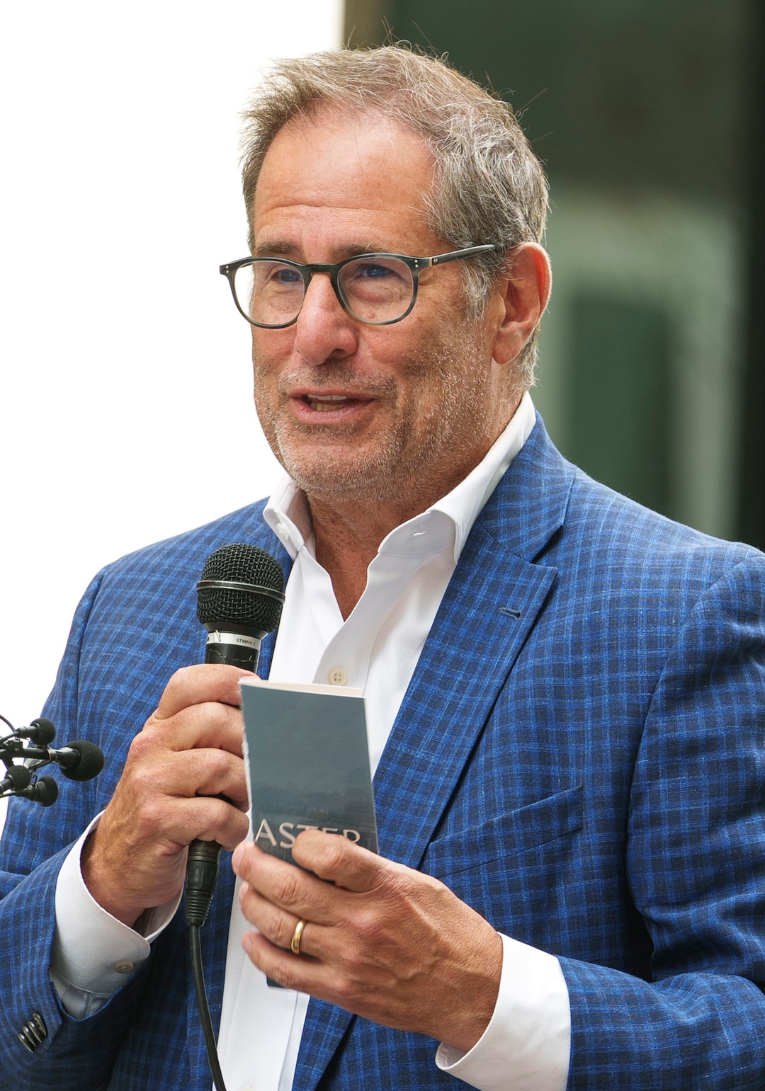 (Leah Hogsten | The Salt Lake Tribune)  David Brint, principal with Brinshore Development, emcees the opening of The Aster, a new complex at 255 S. State, which offers 190 residential and mixed-income units, open-air spaces and community gathering spaces, May 2, 2023.