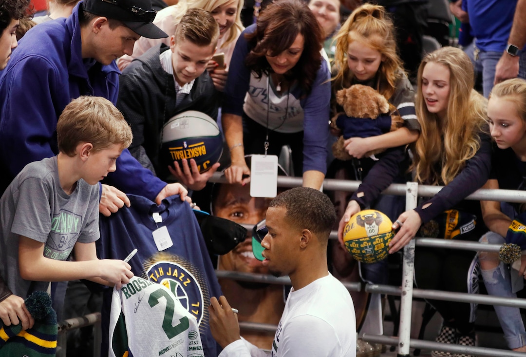 Utah Jazz guard Rodney Hood signs autographs before the team's NBA basketball game against the Indiana Pacers, Saturday, Jan. 21, 2017, in Salt Lake City. (AP Photo/George Frey)