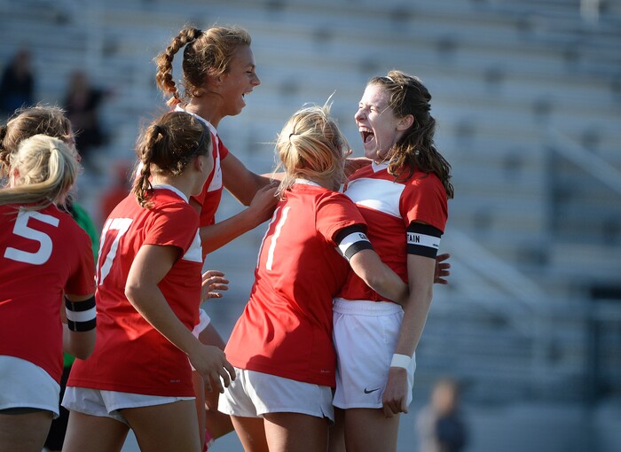 (Scott Sommerdorf   |  The Salt Lake Tribune)   East's captain Catherine Hill, right, celebrates Emily Jensen's header to give East a 1-0 lead during first half play. East beat Corner Canyon 4-1 in a Class 5A girls' soccer state quarterfinal, Thursday, October 12, 2017. 