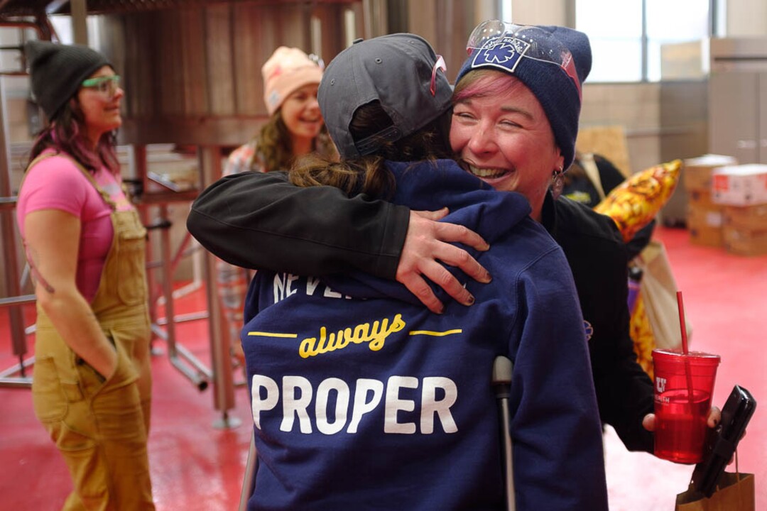 (Trent Nelson | The Salt Lake Tribune)  
Jamie Burnham embraces Amanda Madsen as top female brewers from across the state gathered at Roosters Brewing Co in Ogden on Friday March 8, 2019 — International Women's Day — to brew “On Wednesdays We Wear Pink Boots" Cold IPA.