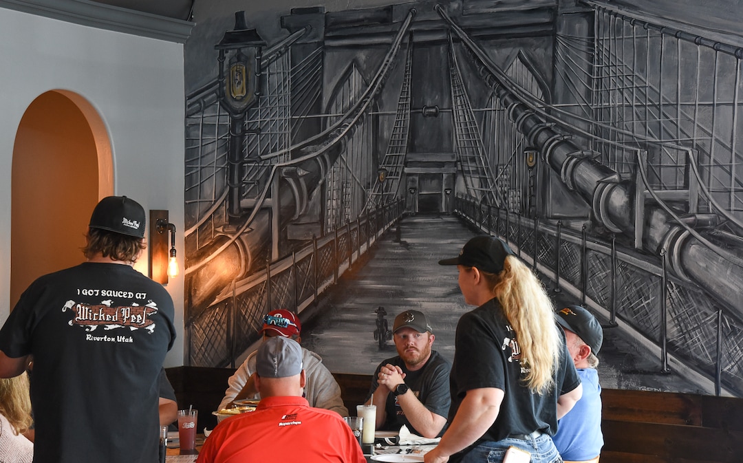 (Francisco Kjolseth  |  The Salt Lake Tribune)  Murals adorn Wicked Peel Pizza Kitchen in Riverton as Charlie Wallwork and his wife Marylee take orders from customers.