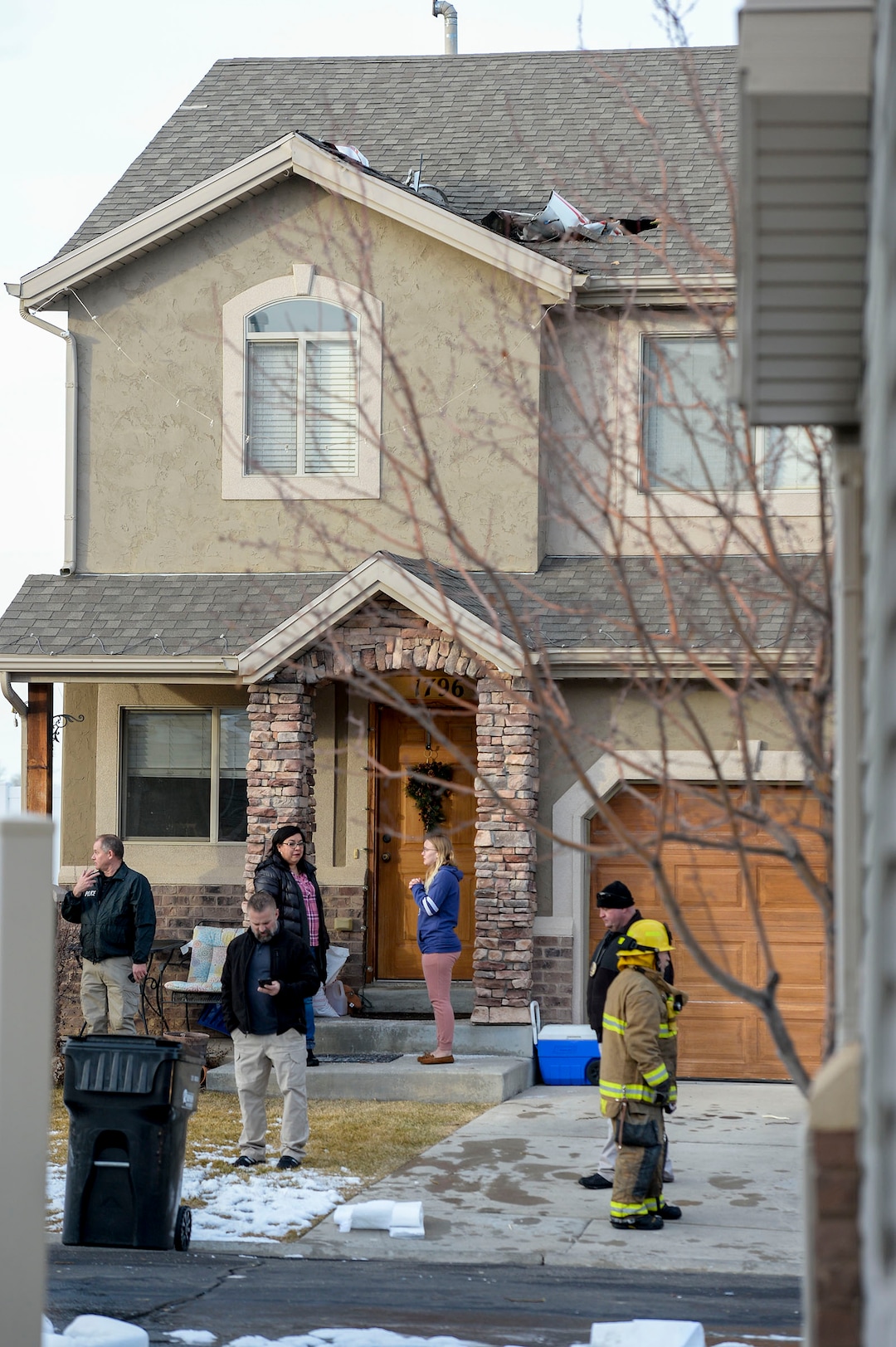 (Leah Hogsten  |  The Salt Lake Tribune) Weber County emergency personnel and firefighters work the scene of a small, private plane that crashed in a residential neighborhood in Roy, Jan 15, 2020.  A 64-year-old pilot was killed.