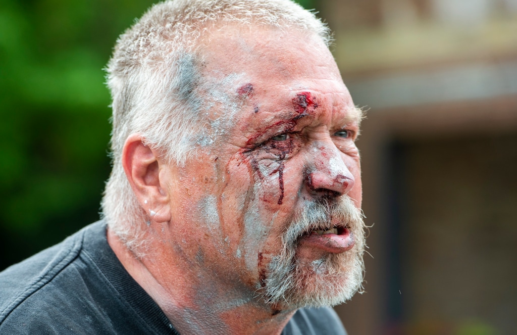 (Rick Egan  |  The Salt Lake Tribune)    Brandon McCormick was beaten up by protesters after brandishing a bow and arrow at protest Saturday, May 30, 2020.