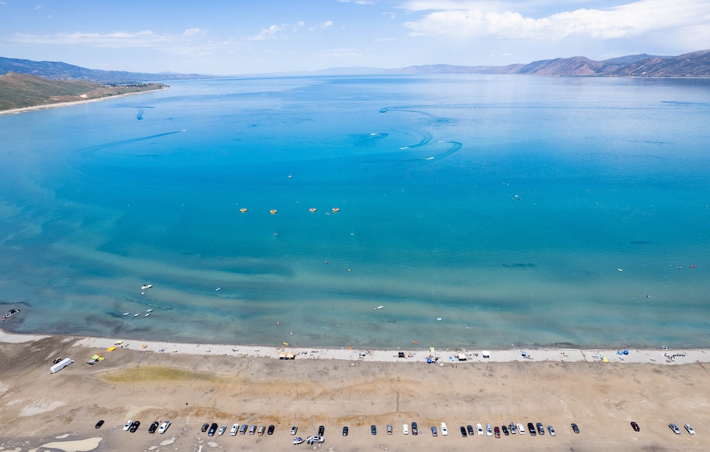 (Francisco Kjolseth | The Salt Lake Tribune) People recreate in the clear blue waters of Bear Lake at Rendezvous Beach on Thursday, June 30, 2022. A new study is out showing the economic contributions of Bear Lake, underscoring the need to keep the lake healthy.