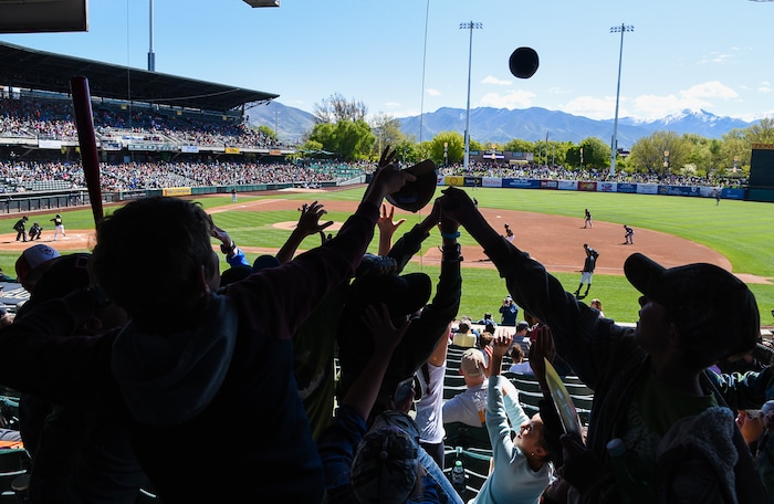 (Francisco Kjolseth  |  The Salt Lake Tribune)  Kids scramble for a tossed baseball as part of the annual Bees kids day game at Smith's Ballpark on Thursday, May 2, 2019.
