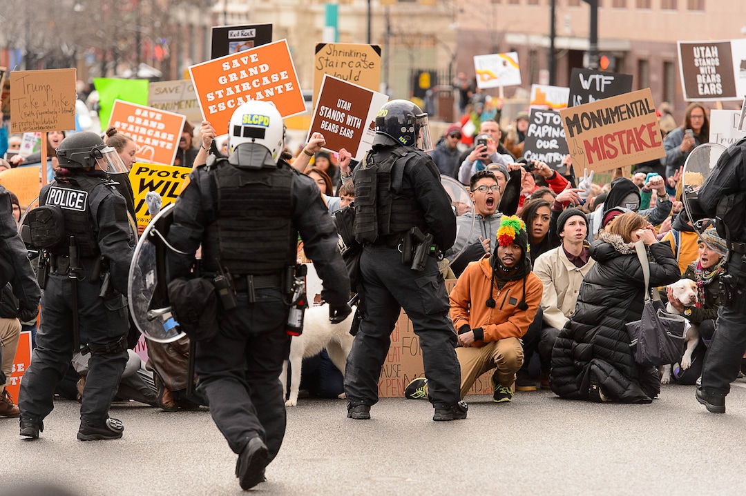 (Trent Nelson | The Salt Lake Tribune)  Protesters and police meet downtown after a rally against a visit by President Donald Trump, Monday December 4, 2017.