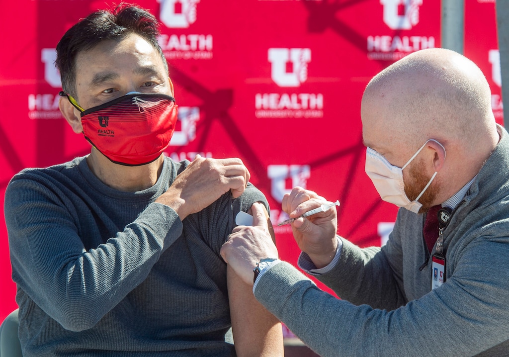 (Rick Egan | Tribune file photo)  Nathan Hagen administers a COVID-19 vaccination to Wyn Chao during a news conference on Monday, March 1, 2021. On Thursday, the state Senate passed a bill that extends vaccine exemptions to higher education students and allows those who are not immunized to learn in-person.