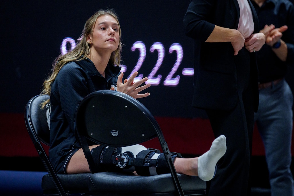 (Trent Nelson  |  The Salt Lake Tribune) An injured Grace McCallum cheers on her teammates as Utah hosts California, NCAA gymnastics in Salt Lake City on Friday, Feb. 24, 2023.