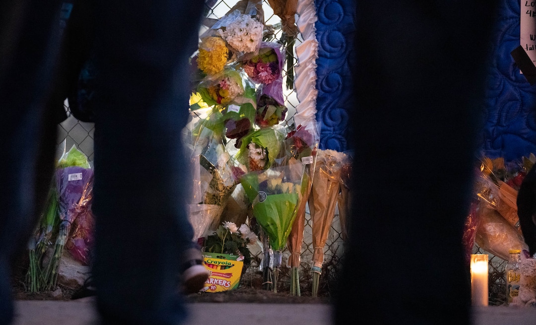 (Francisco Kjolseth | The Salt Lake Tribune) More that a hundred people gather at the candlelight vigil of Hunter High football players Paul Tahi , 15, Tivani Lopati, 14, and Ephraim Asiata, 15, on Friday, Jan 14, 2022, in West Valley City, near Hunter High School along 1400 South at Mountain View Corridor. Paul Tahi and Tivani Lopati were killed in a shooting, while Ephraim Asiata remains in critical condition.