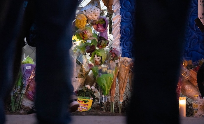 (Francisco Kjolseth | The Salt Lake Tribune) More that a hundred people gather at the candlelight vigil of Hunter High football players Paul Tahi , 15, Tivani Lopati, 14, and Ephraim Asiata, 15, on Friday, Jan 14, 2022, in West Valley City, near Hunter High School along 1400 South at Mountain View Corridor. Paul Tahi and Tivani Lopati were killed in a shooting, while Ephraim Asiata remains in critical condition.