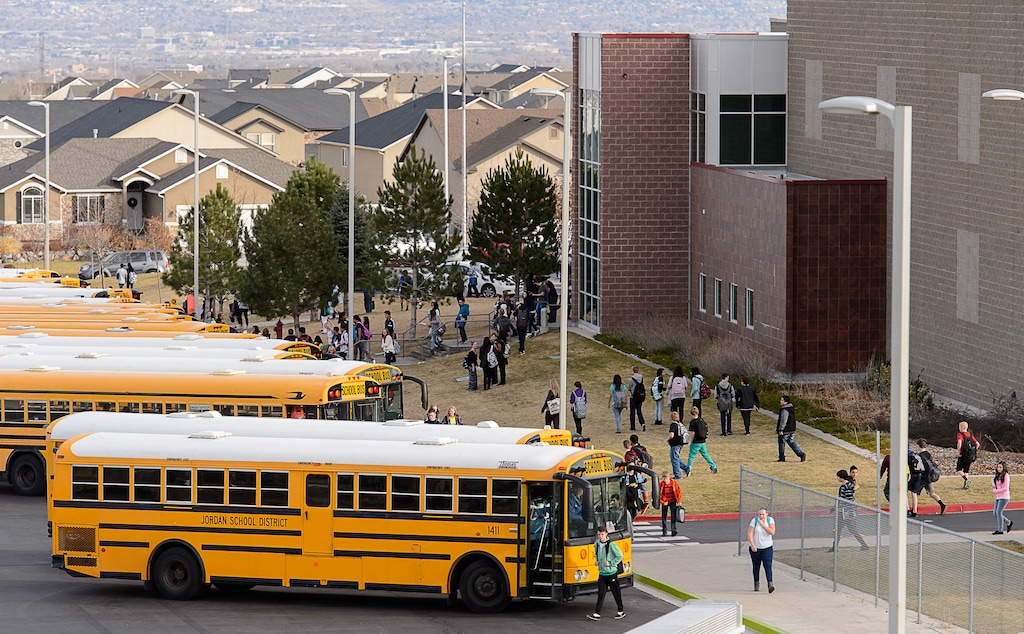 Trent Nelson | The Salt Lake Tribune
Students load into buses after a day of classes at Sunset Ridge Middle School in West Jordan, Friday December 5, 2014. The City of West Jordan, City of South Jordan and Herriman City held a joint press conference to discuss their opposition to a proposed relocation of the state prison to West Jordan. The proposed location is 9000 South and 7300 West.