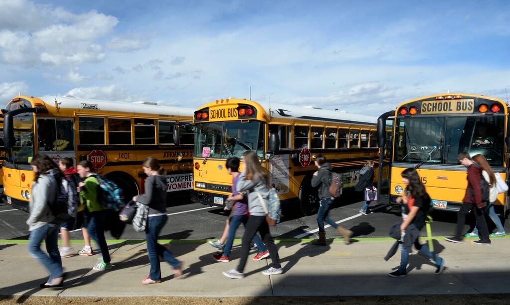 Francisco Kjolseth  |  The Salt Lake TribuneKids get ready to head home as they load onto their school buses at Sunset Ridge Middle school in West Jordan on Monday, March 3, 2014.