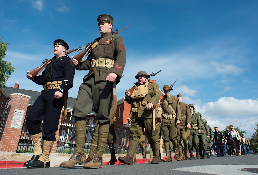 (Rick Egan  |  The Salt Lake Tribune)      Members of the Utah Military History Group march to the Fort Douglas Cemetery for the Memorial Day observance Monday, May 28, 2018.