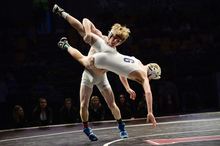 (Francisco Kjolseth  |  The Salt Lake Tribune) Oakley Ridge of Pleasant Grove goes for a ride as he battles Kegan Leatherow of Fremont in the Class 6A 120 state wrestling championship match at the Utah Valley University UCCU Center on Thursday, Feb. 8, 2018.