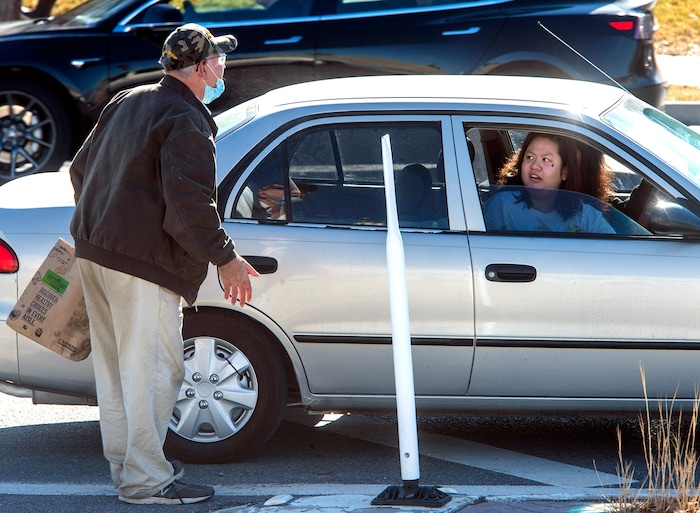 (Rick Egan | The Salt Lake Tribune) George Zinn responds to a woman who said derogatory things about President Donald Trump at the Utah Capitol where a dozen protesters gathered on Sunday, Jan. 17, 2021.
