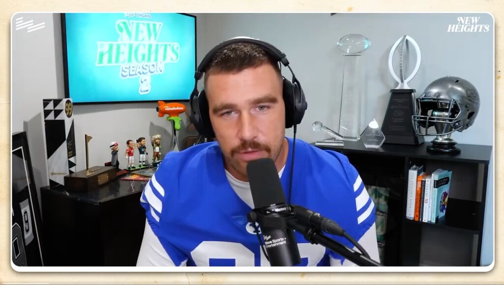 (Screenshot) Kansas City Chiefs tight end Travis Kelce sports a BYU jersey on an episode of his "New Heights" podcast. Kelce, a Cincinnati alum, was given the jersey after losing a bet involving the Bearcats and Cougars game last weekend.