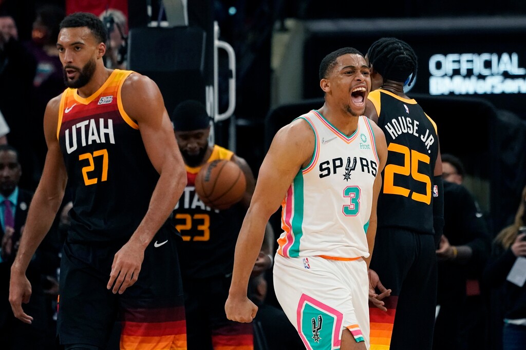 San Antonio Spurs forward Keldon Johnson (3) celebrates a basket against the Utah Jazz during the second half of an NBA basketball game, Friday, March 11, 2022, in San Antonio. (AP Photo/Eric Gay)