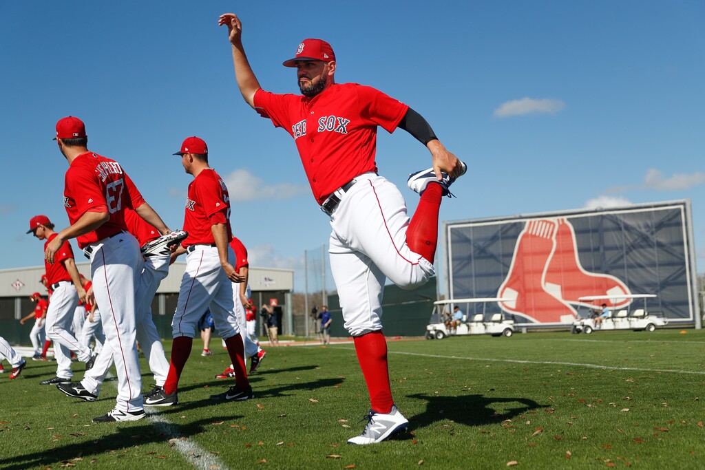 FILE - In this Feb. 20, 2018, file photo, Boston Red Sox's Eduardo Nunez stretches before practice during baseball spring training in Fort Myers, Fla. With Dustin Pedroia rehabbing from offseason knee surgery, Red Sox manager Alex Cora announced Thursday, March 8, that Nunez will be the starting second baseman on opening day. (AP Photo/John Minchillo, File)