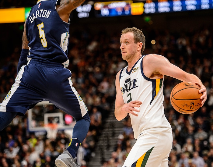 (Trent Nelson | The Salt Lake Tribune)  Utah Jazz forward Joe Ingles (2) defended by Denver Nuggets guard Will Barton (5) as the Utah Jazz host the Denver Nuggets, NBA basketball in Salt Lake City, Wednesday October 18, 2017.