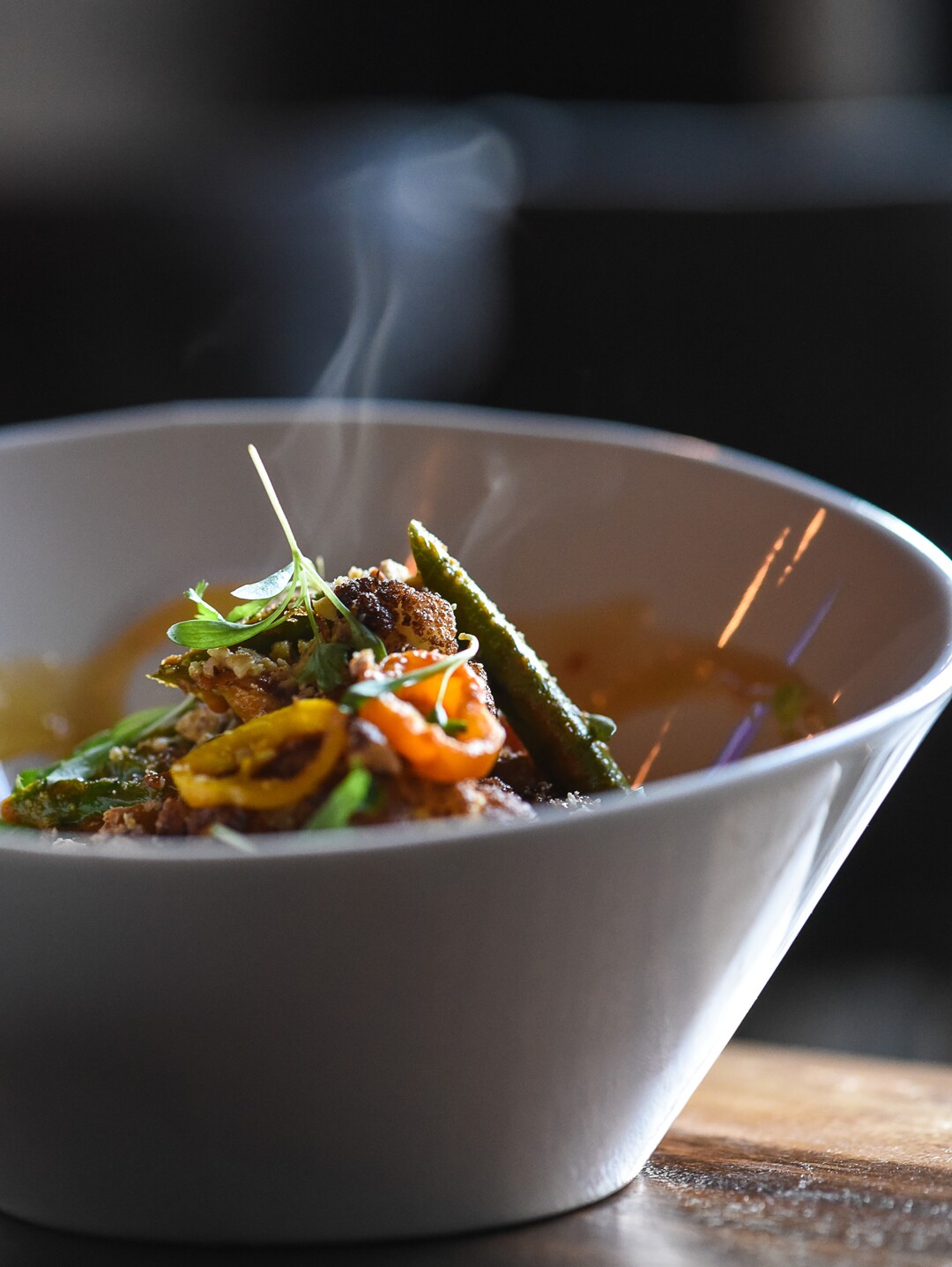 (Francisco Kjolseth  |  The Salt Lake Tribune)  Tomato curry roasted cauliflower with basmati rice, asparagus tips, chickpeas, crushed nuts, scallions, baby peppers and cilantro at the new London Belle Supper Club, a new Salt Lake City bar named after Belle London, a famous Utah madam, at 321 S. Main.