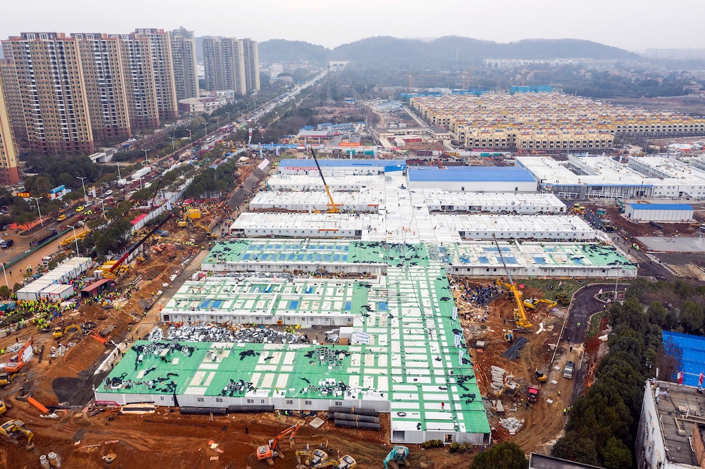(Chinatopix via AP) The Huoshenshan temporary field hospital under construction is seen as it nears completion in Wuhan in central China's Hubei Province, Sunday, Feb. 2, 2020. The Philippines on Sunday reported the first death from a new virus outside of China, where authorities delayed the opening of schools in the worst-hit province and tightened quarantine measures in a city that allow only one family member to venture out to buy supplies.