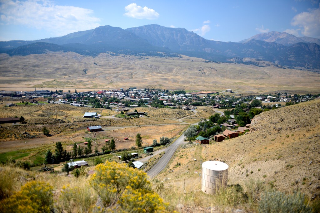(Rachel Leathe/Bozeman Daily Chronicle via AP) This Aug. 17, 2017 photo shows a view of Gardiner, Mont., the gateway town to Yellowstone National Park. Gardiner is struggling with housing affordability as home prices rise and owners turn rental properties into vacation rentals. The shift is contributing to a loss of students in the school district.