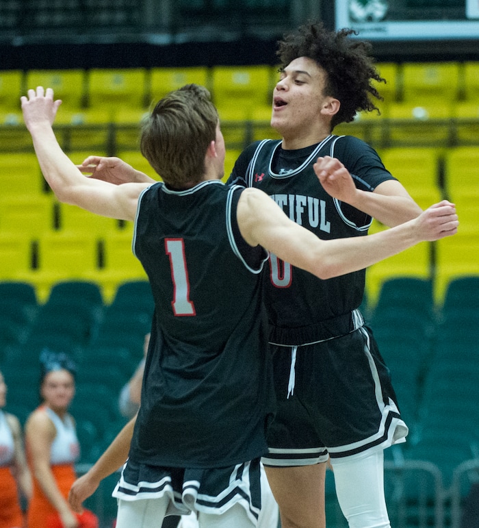(Rick Egan  |  The Salt Lake Tribune)   Bountiful Braves Cole Knudsen (1) and  Isaac Kime (0) celebrate the Braves win over the Falcons, in 5A basketball playoff action between the Bountiful Braves and Skyridge Falcons, at the UCCU Center in Orem, Monday, Feb. 26, 2018.