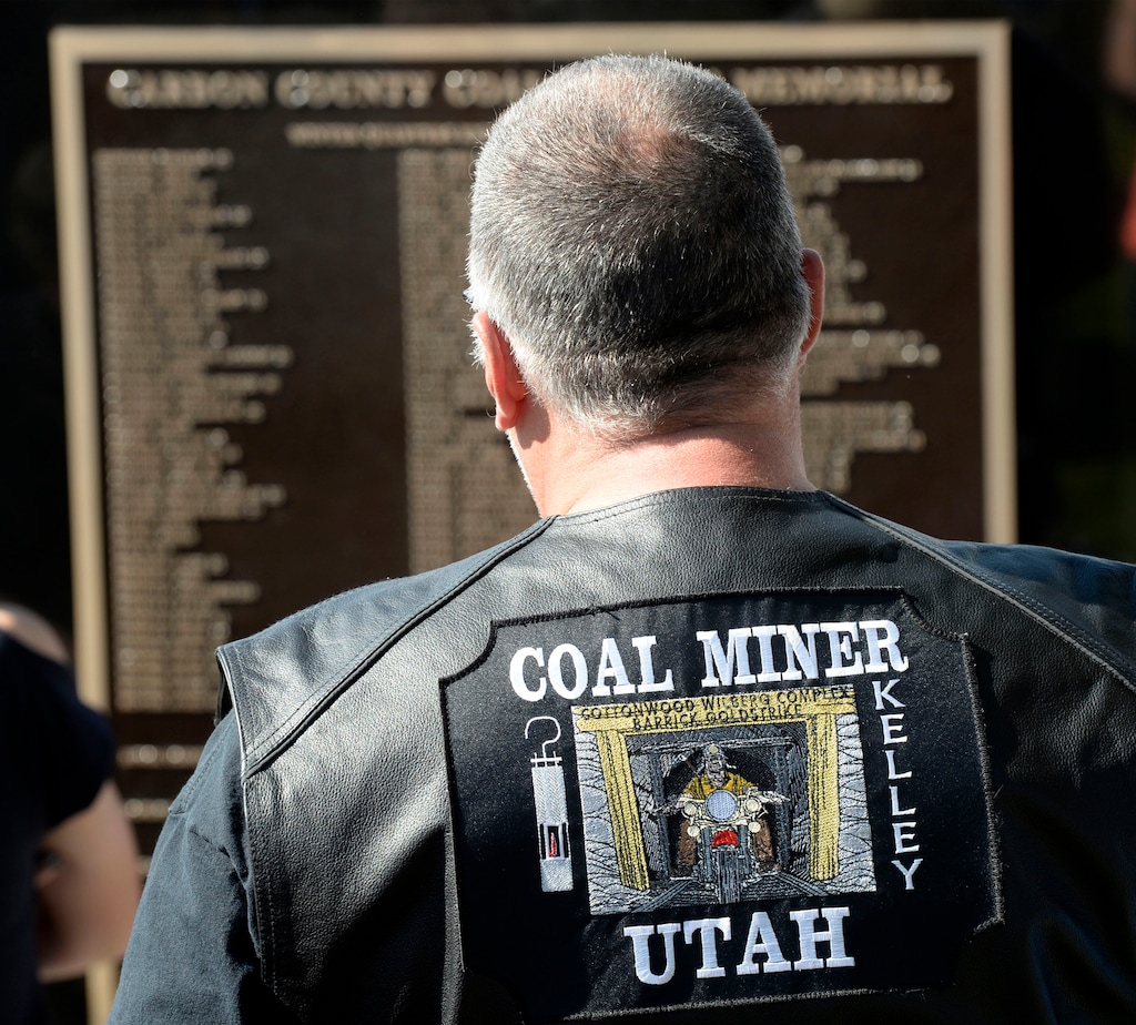Al Hartmann  |  The Salt Lake Tribune
Miner take a look at names on the Carbon County Coal Miners' Memorial. Two statues and several large plaques with 1,400 names of fallen miners now resides in the Price Peace Park along Main Street.