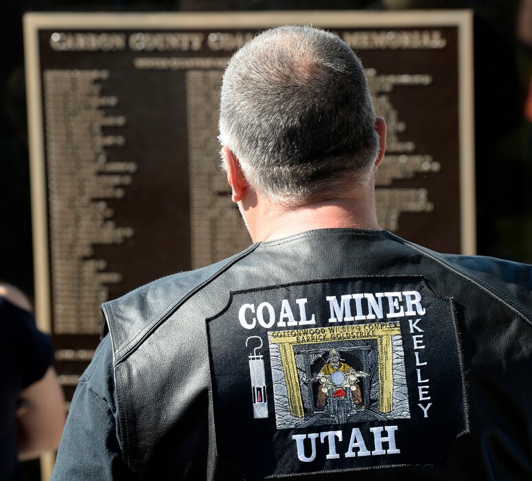 Al Hartmann  |  The Salt Lake Tribune
Miner take a look at names on the Carbon County Coal Miners' Memorial. Two statues and several large plaques with 1,400 names of fallen miners now resides in the Price Peace Park along Main Street.