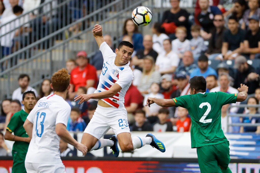 United States' Rubio Rubin (23) heads the ball past Bolivia's Carlos Anez (2) as Josh Sargent (13) looks on during the first half of an international friendly soccer match, Monday, May 28, 2018, in Chester, Pa. (AP Photo/Matt Slocum)